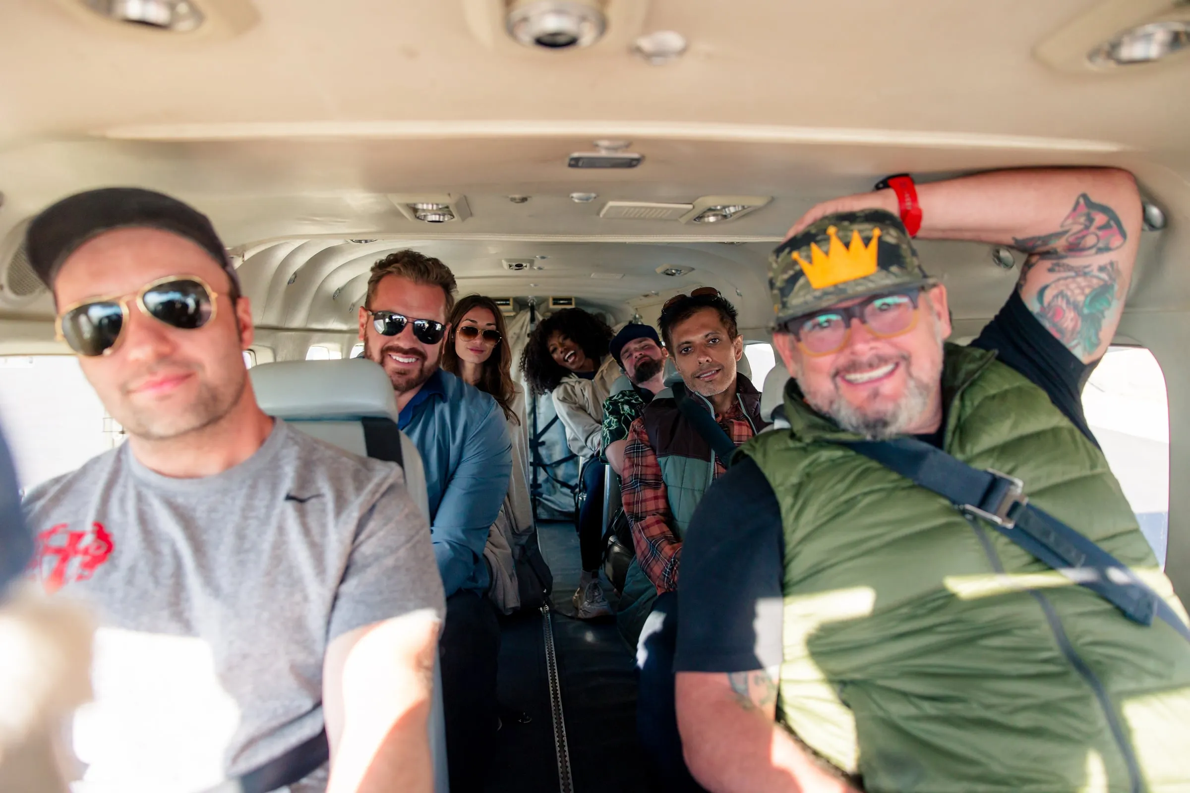 Friends laughing together on a small plane
